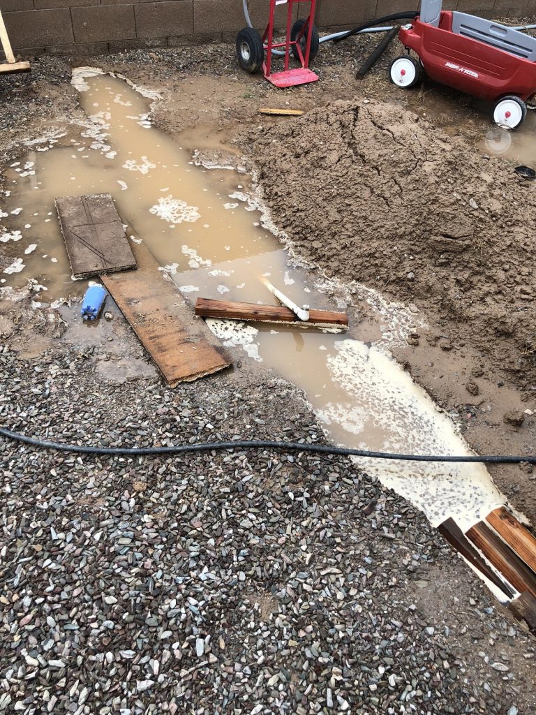 18in deep trench completely submerged by rain water